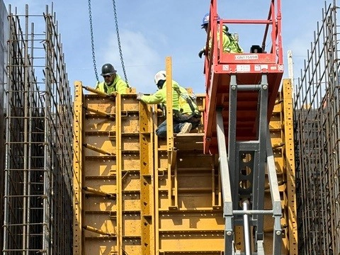 Castlerock crew safely using lift equipment on a job site